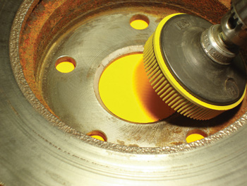 Dirt, corrosion, and distortion in the hub area of any brake rotor can cause pedal pulsation complaints.