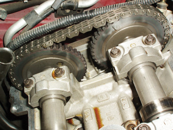 The timing chain at the top center of this photo is typical of many V-block, chain-driven double overhead-camshaft engines. Note the timing mark on the right-hand gear.