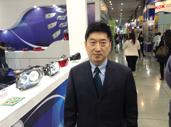 Michael Hu, of Depo Group/Maxzone Auto Parts, displayed company headlamp prototypes.  