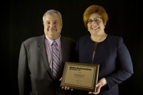 Richard Scovner and Patti Feck (Tenneco Plaque).