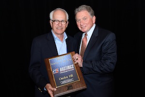 Phil Kommers (left), vice president, Hastings aftermarket sales, accepts the award for Vendor of the Year for order fill from Roy Kent, vice president, Federated Auto Parts.