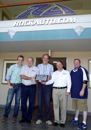 Executives of RockAuto receive Auto 7’s 2014 Internet Retailer of the Year award on July 9, 2014. Gathered at RockAuto’s offices in Madison, Wis., are, from left: RockAuto Product Manager Ben Sobczak, Auto 7 Senior Vice President Jim Murphey, RockAuto President Jim Taylor, Auto 7 President Steven Kruss and RockAuto Supply Chain Manager David Williams.