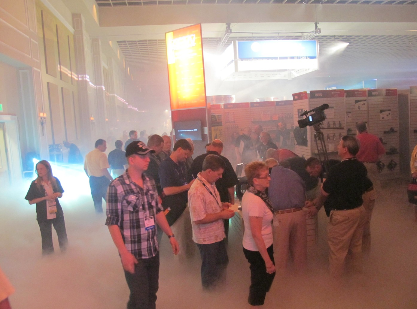 aftermarket auto parts alliance convention attendees stream into the vendor hall to a fog, music and light show.